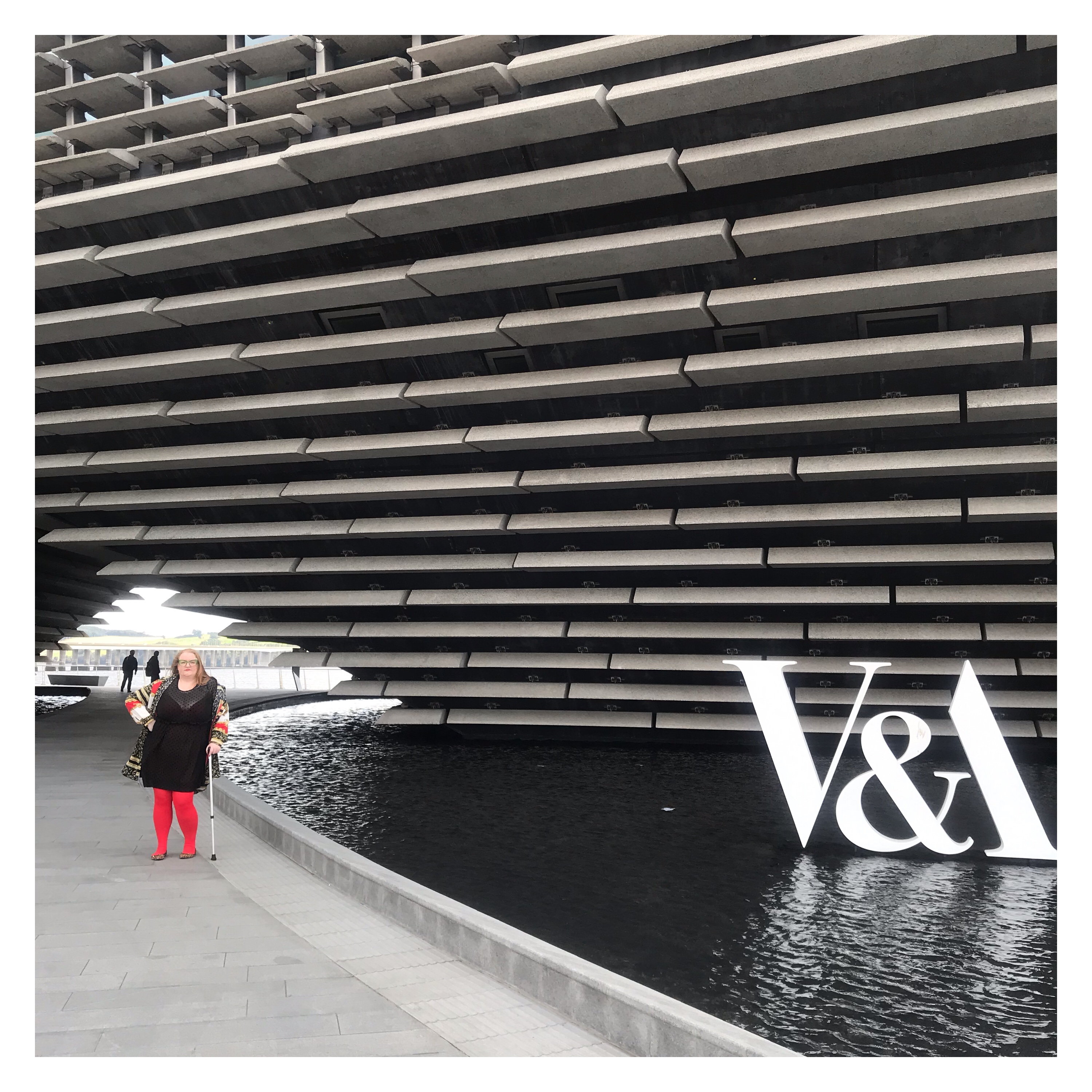 Plus size woman posing at v&a