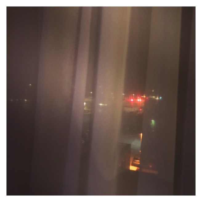 Blurry lights through blinds 