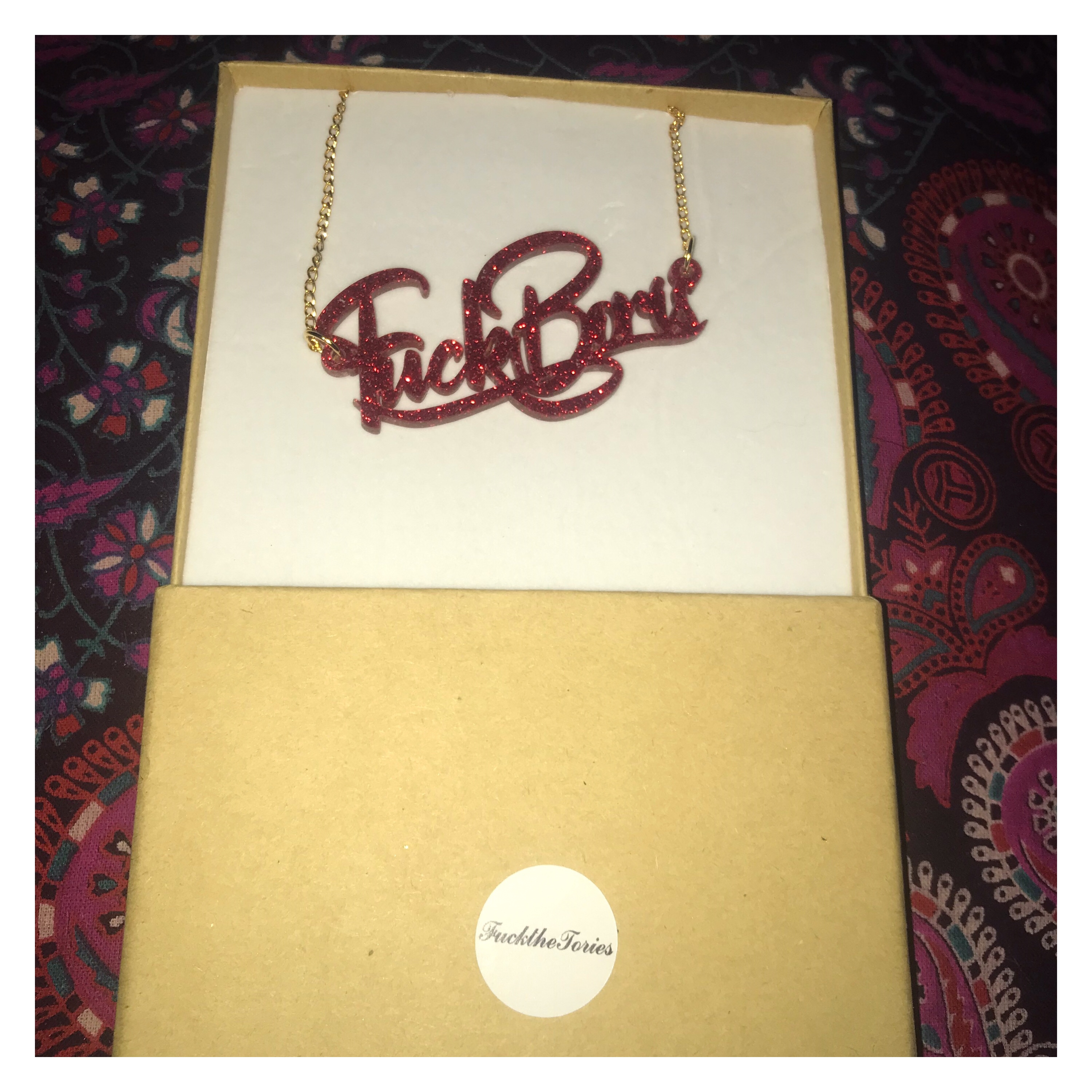 Red glittery fuck Boris necklace in jewellery box 