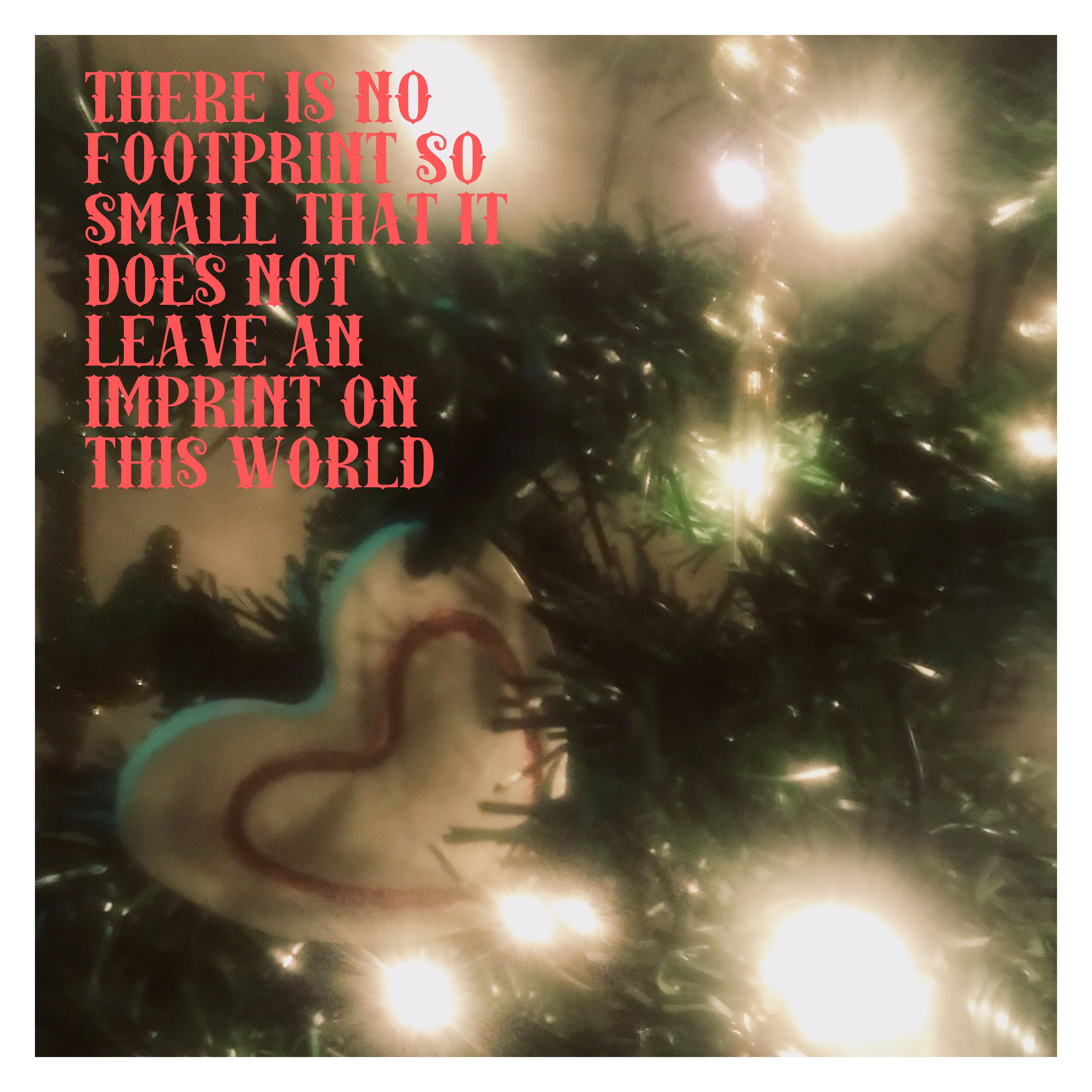 Xmas tree, heart decoration with text no foot is too small to leave van imprint in this world 
