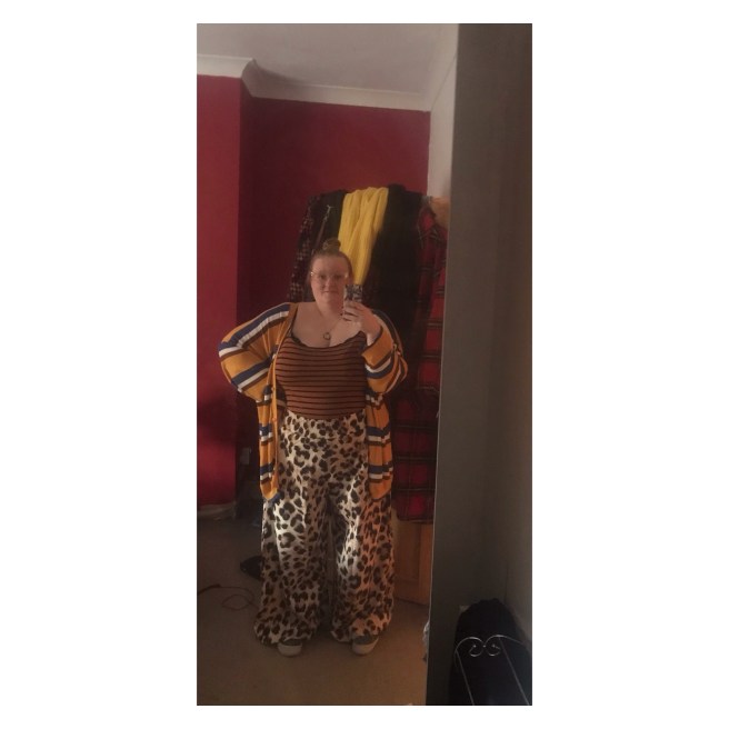Plus size woman in leopard print trs & stripey vest 