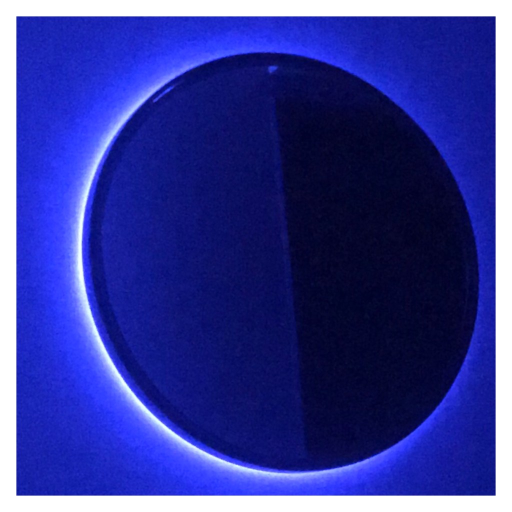 Circular mirror with blue backlighting  