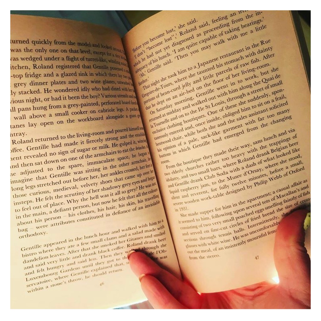 Thumb & forefinger  holding book open  