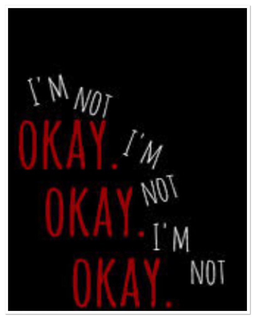 The words I’m not ok on black background 