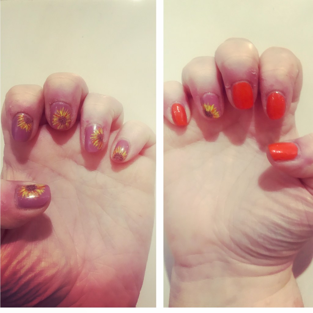 Orange manicure with sunflower design 