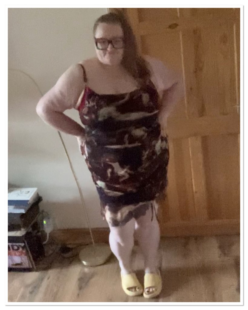 Ly is wearing a form fitting churub print dress