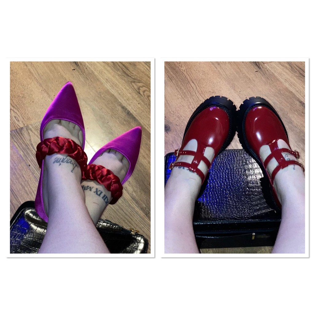 Picture is tattooed feet in two different pairs of shoes. Pink satin flats with red ruched band  & burgundy shiny Mary Janes with chunky soles. 