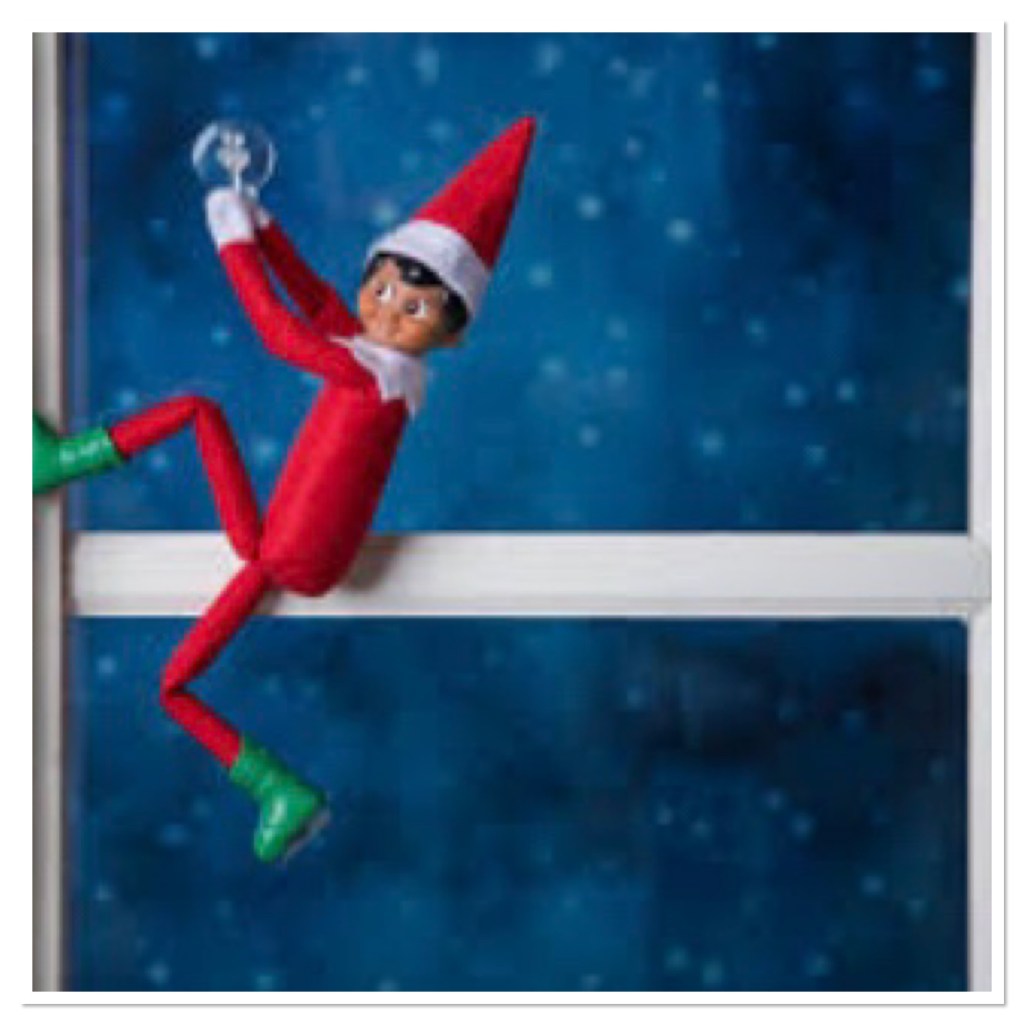 elf on the shelf doll climbing a window 